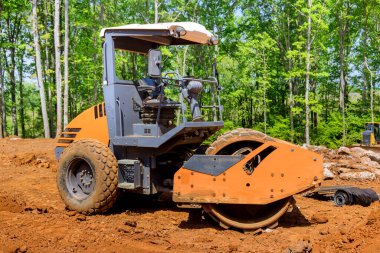 Construction industrial grader work of the process of leveling for preparation of land to a new building