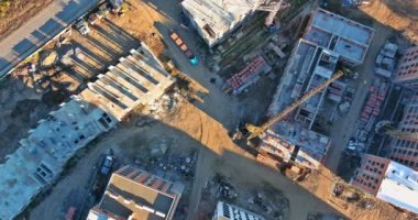 As part the construction a block flats, several tower cranes of different heights were placed on building site