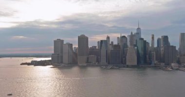 Stunning panorama of the downtown skyline of New York City on the Hudson river in the middle of cityscape Manhattan