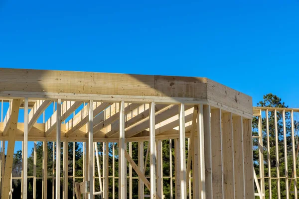 A new building wooden trusses is being framework house with timber frame stick beam is currently under construction