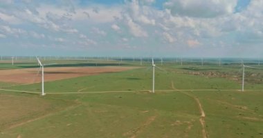 This is wind power electricity farm row of windmill renewable energy turbines in the country of Texas, USA.