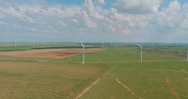 The wind power electricity farm in Texas USA has a row of wind turbines that are used for renewable energy generation
