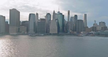 On the Hudson river, there is a panoramic view of cityscape midtown New York Manhattan downtown skyline