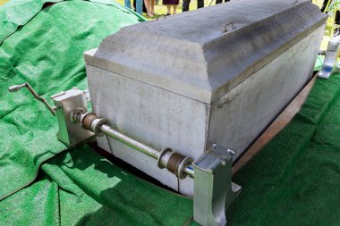 There will be funeral service in cemetery with the coffin entering grave on an automatic elevator before it is lowered into the grave before burial.