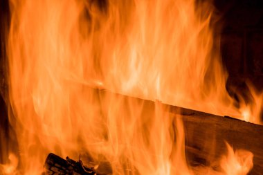 In traditional firewood oven for wood fired pizza, a flame is blazing from the fire which is burning brightly