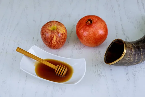 Traditionally ritual kosher dessert food with Apple, Honey, Pomegranate, and Shofar are some of the traditional symbols of Rosh Hashanah, the Jewish New Year holiday