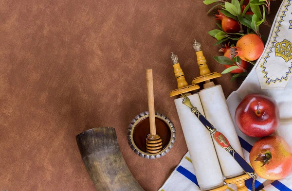 Traditional Jewish New Year symbols include apple, honey, pomegranate and shofar during the Jewish New Year holiday of Rosh Hashanah