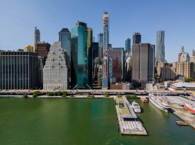 On the Hudson river, there is a panoramic view of cityscape midtown New York Manhattan downtown skyline