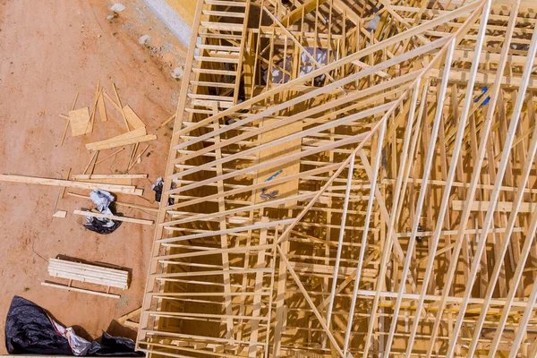 Under construction of a wooden trusses roof beam for new house an aerial view