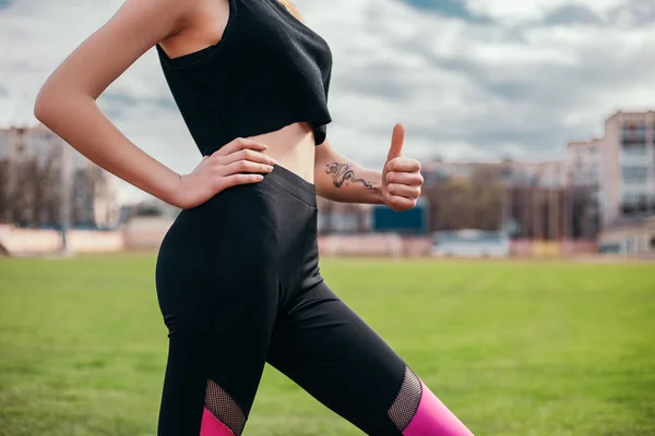 Slim Woman Standing Posing Showing Body Abdominal Press Muscles Stadium — Fotografia de Stock