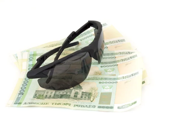 Men's sunglasses and Belarusian money on a white background — Stock Photo, Image