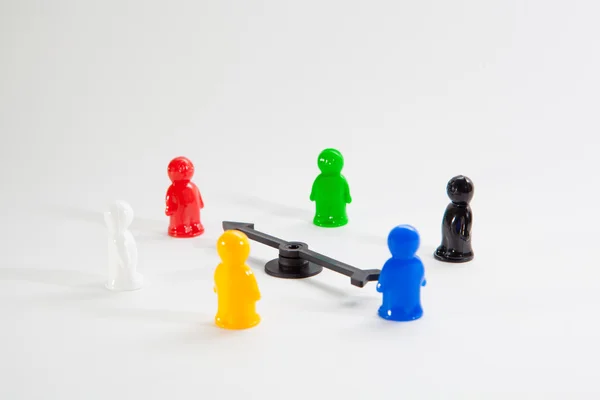 Colorful plastic toy people on white background — Stock Photo, Image