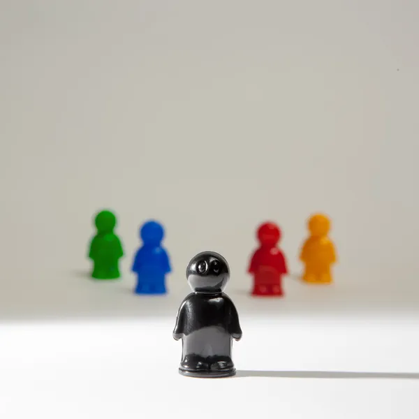 Colorful plastic toy people on white background — Stock Photo, Image