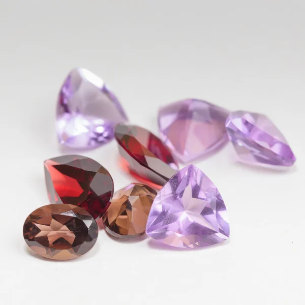 Colorful gemstones with garnet stone — Stock Photo, Image