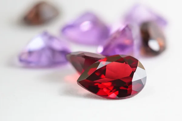 Colorful gemstones with garnet stone — Stock Photo, Image