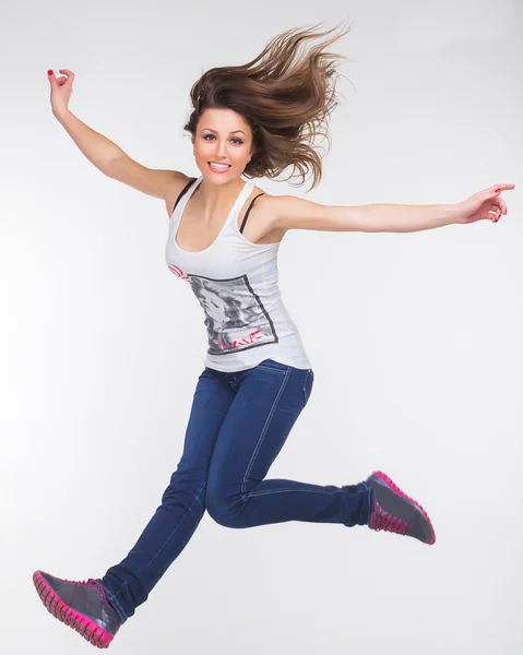 Photo the beautiful girl in a jump — Stock Photo, Image