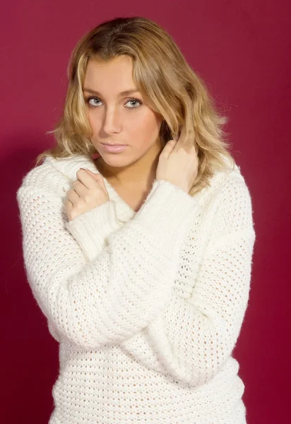 A young girl in a white sweater — Stock Photo, Image