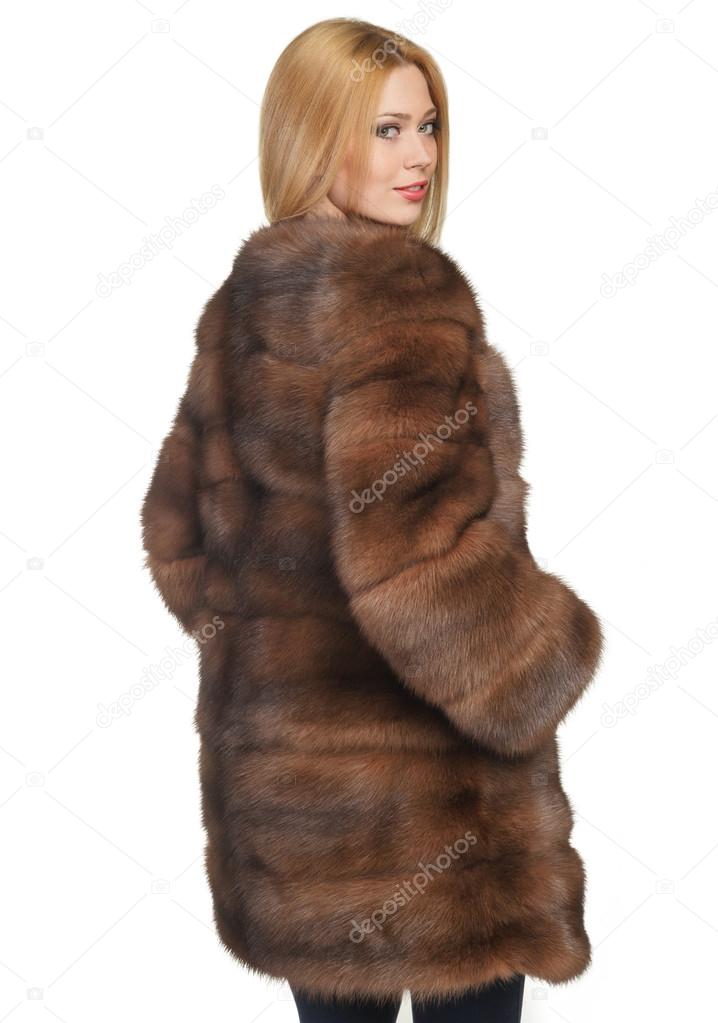 beautiful girl in a fur coat