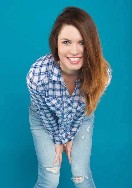 Beautiful girl in a shirt and jeans posing — Stock Photo, Image