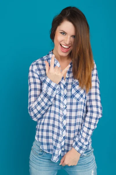 Beautiful girl in a shirt and jeans posing — Stock Photo, Image