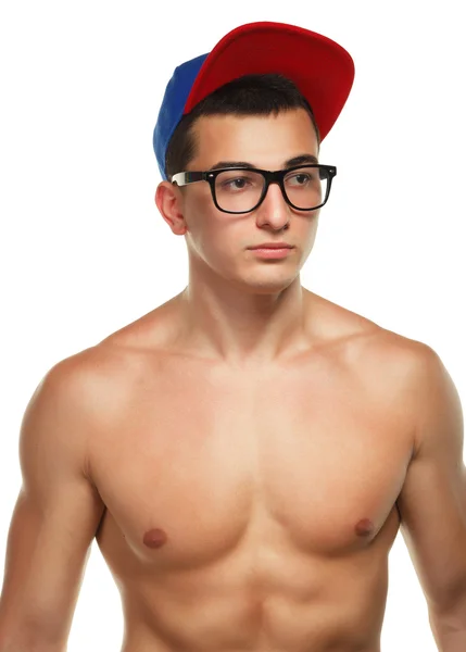 Athletic guy in glasses and a cap — Stock Photo, Image