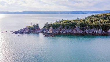 Drone view of Green Island in Canada. Island Aerial View. Beach Island. Blue Water Island.