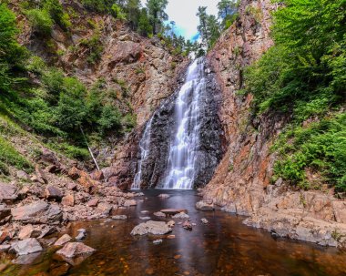 Waterfall between the Rocky Mountains and Jungle in Canada