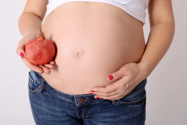 Pregnant woman and garnet — Stock Photo, Image