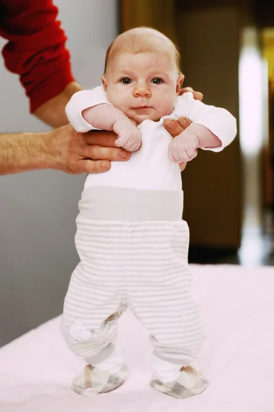 Baby in father 's hands — стоковое фото