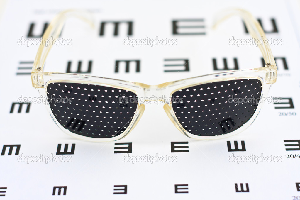 Pinhole glasses on an children eye chart