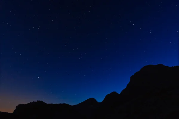 Mountain silhouette in the night