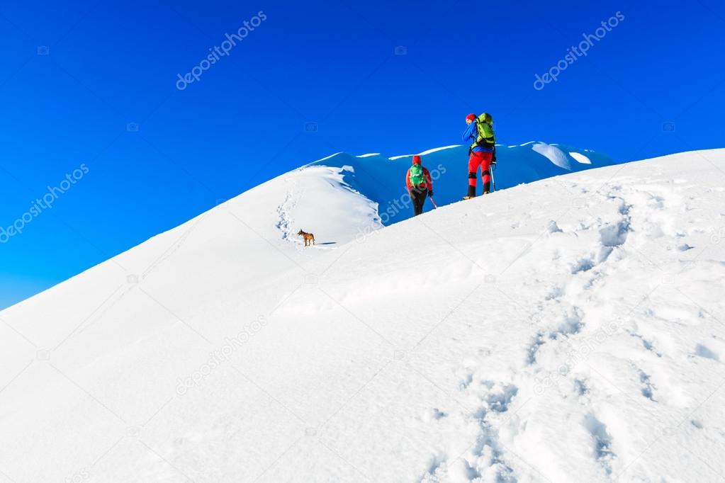 Mountaineers walking on the mountain ridge