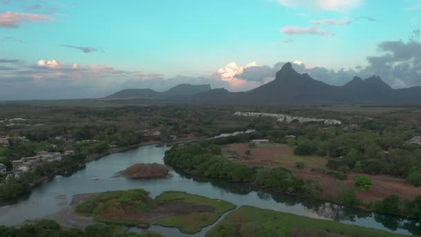 Landscape of a pacific island with boats and lagoon in aerial view sunset. Tamarin, Mauritius. — Stockvideo