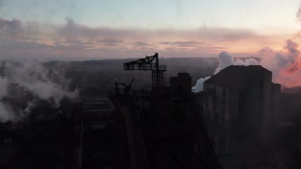 Drone around toxic enterprise chimneys tubing against the sky background release black smoke. Factory pollutes environment. Ecology pollution concept — Stockvideo