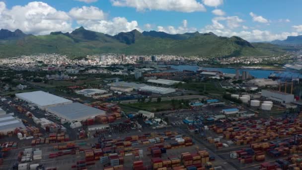 Aerial view Port Louis, Mauritius island container port. Loading the ship with containers for transportation. Container cargo shipping loading ship in import export business logistic — Stock Video