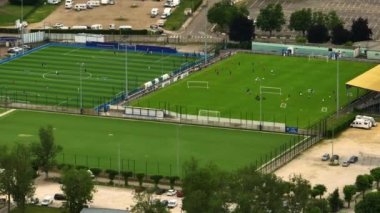 Aerial view of Auxerre Soccer Field and Two Professional Teams Playing. Energetic Game in the Middle of the Field. Important Match on International Championship. High quality 4k footage