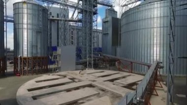 Industrial zone with factory or Plant processing of sunflower oil and oilseeds. Aerial view. High quality FullHD footage