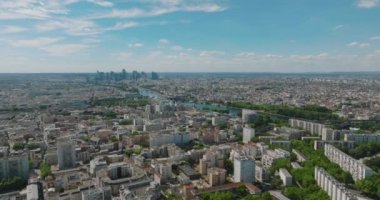 Paris aerial video with view of bridges, Seine river. Historic Parisian city center from above during warm summer. Famous holidays vacation destination. High quality 4k footage