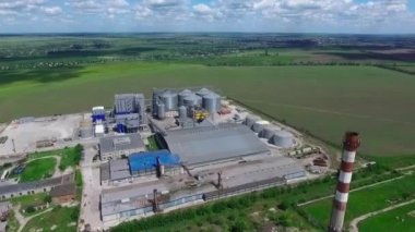 Industrial zone with factory or Plant processing of sunflower oil and oilseeds. Aerial view. High quality FullHD footage