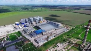Industrial zone with factory or Plant processing of sunflower oil and oilseeds. Aerial view. High quality FullHD footage