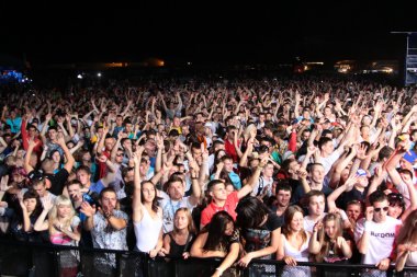 MINSK, BELARUS - JULY 6: Global Gathering Festival crowd at Borovaya airfield on July 6, 2013 in Minsk, Belarus