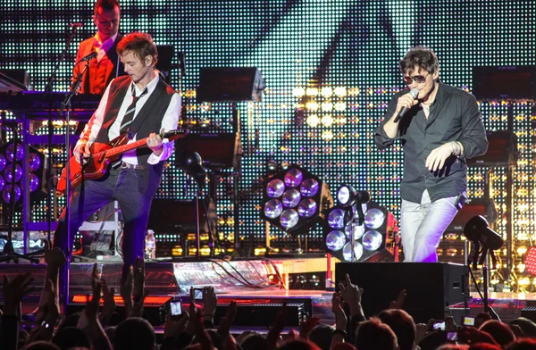 "A-ha" band (Morten Harket, Paul Waaktaar-Savoy, Magne Furuholmen) performs during the live concert in Minsk on November 6, 2010 — Stock Photo, Image