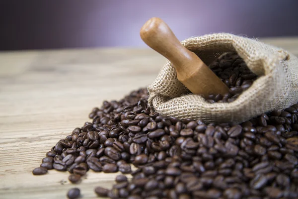 Coffee beans inscription on wooden table — Stock Photo, Image