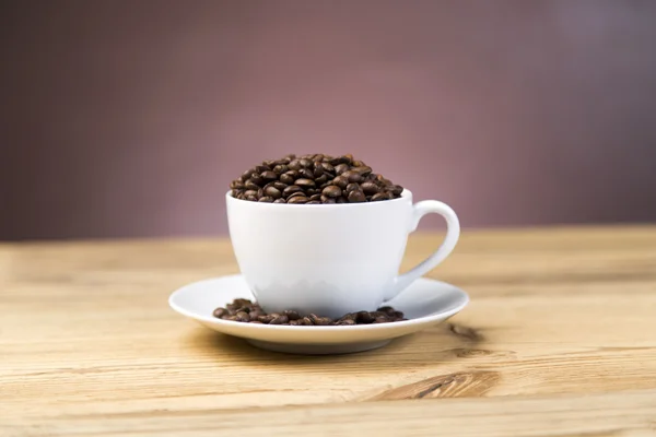 Coffee beans inscription on wooden table — Stock Photo, Image