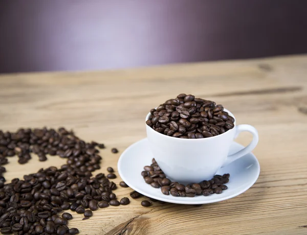 Coffee beans inscription on wooden table — Stock Photo, Image