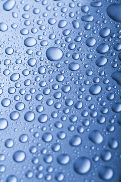 Drops of water on blue background — Stock Photo, Image