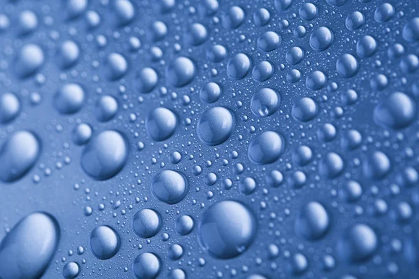 Drops of water on blue background — Stock Photo, Image