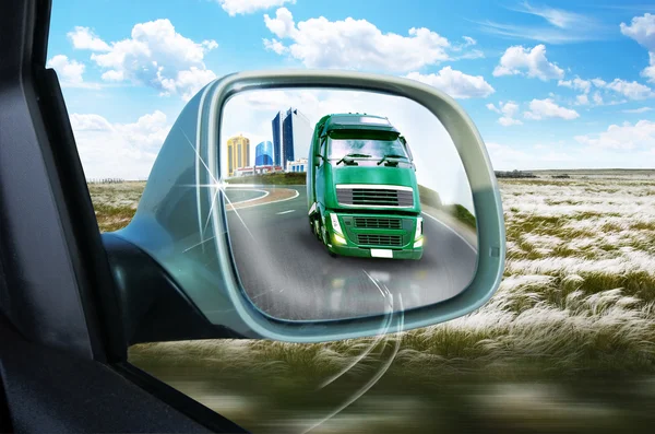 Truck in the rear-view mirror