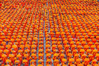 BANGKOK , THAILAND - September 8 : 10,000 Buddhist monks waiting for people give food offerings on September 8, 2013 Pratunam in Bangkok, Thailand. clipart