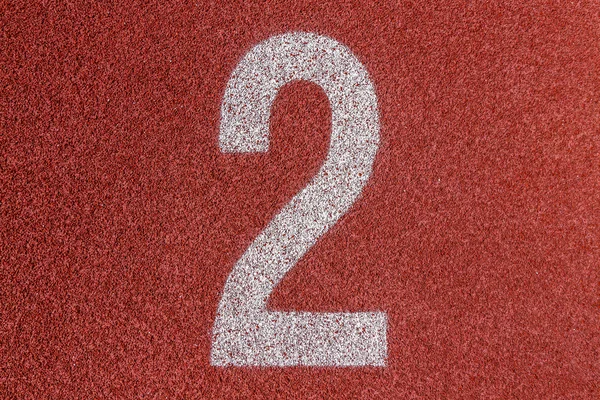 "2" Numbers on red running track — Stock Photo, Image